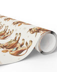 Roll of wrapping paper with storybook illustrations of babies and cow design on a light background.