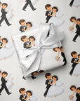 A gift box wrapped in ivory wedding wrapping paper featuring a repeating pattern of vintage bride and groom couples, tied with a white satin ribbon, on a white background.