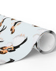 Roll of vintage-style first dance wedding wrapping paper with dancing bride and groom couples in white gowns and black tuxedos on pale blue