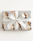 Western wedding wrapping paper with vintage cowboy groom and cowgirl bride, pink Just Hitched ribbons, and golden horseshoes.