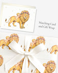 Lion baby shower card shown with matching vintage-inspired lion and baby gift wrap tied with a white satin bow
