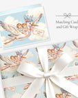 Twin boys stork card with matching twin boys stork gift wrap tied with a white satin bow, labeled Matching Card and Gift Wrap