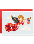 Vintage-style angel in a red folk-pattern gown with navy wings blowing a trumpet with an American flag banner, patriotic angel Christmas card