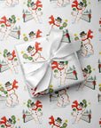 Close-up of retro snowman pickleball Christmas gift wrap showing a snowman playing pickleball.