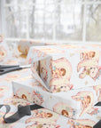 Polar bear baby girl wrapping paper on wrapped gift boxes, winter baby shower gift wrap