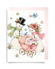Vintage-style snowman couple pushing a pink baby carriage with bluebirds and snowflakes, snowman baby girl Christmas card