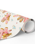 Roll of twin baby girl airplane wrapping paper featuring a repeating pastel pink vintage biplane pattern.