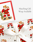 Vintage-style western cowboy Santa Christmas card with matching cowboy Santa gift wrap, tied with white satin ribbon