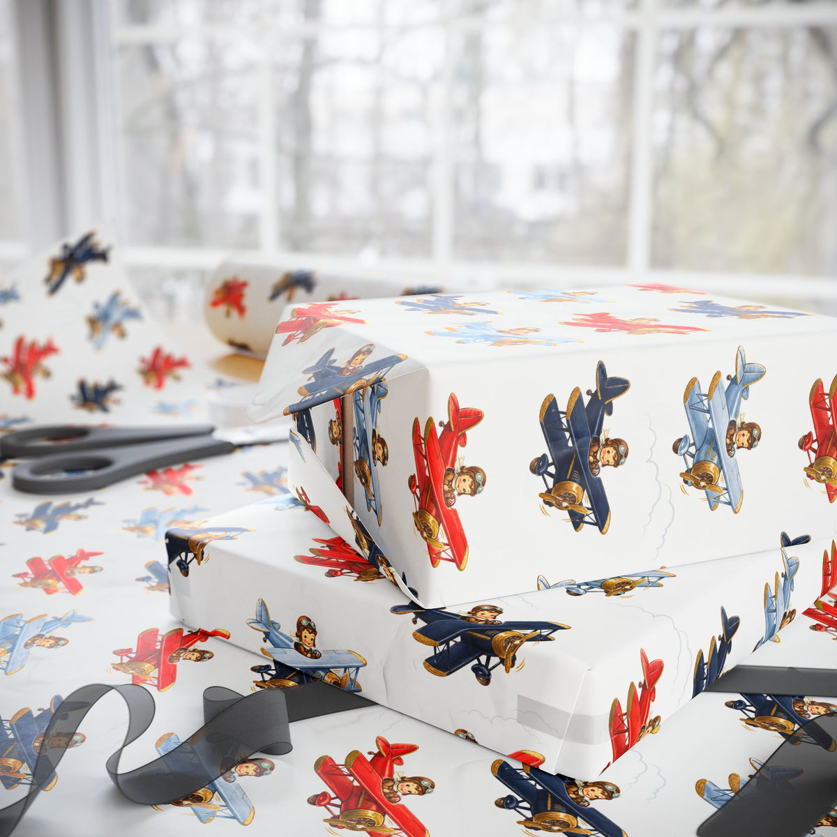 White wrapping paper with a colorful vintage airplane pattern, shown wrapped around gift boxes on a table near a window.