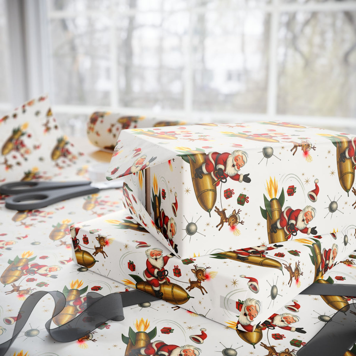 Christmas-themed wrapping paper with a festive print of Santa Claus, reindeer, and gold rockets, shown wrapped around gift boxes on a table with scissors in the background.