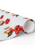 Roll of vintage-style patriotic angel Christmas wrapping paper with trumpet angels in red gowns, angel gift wrap roll