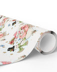 Roll of vintage-style snowman baby girl Christmas wrapping paper with snowmen and pink baby carriages, pink snowman gift wrap roll