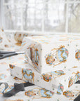Baby gifts wrapped in paper featuring blue hot air balloons and baby boys.
