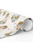 Wrapping paper roll featuring baby boys in blue hot air balloons with floral and ribbon design on a white background.