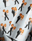 Detailed view of retro wedding gift wrap with a blonde bride in a white gown and a groom in a black tuxedo celebrating their marriage.