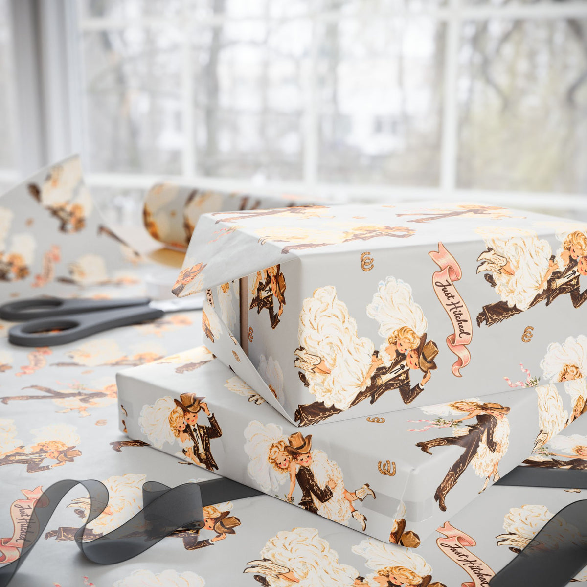 Gift wrapped in western wedding paper featuring illustrated bridal couples, pink ribbons, and horseshoes.