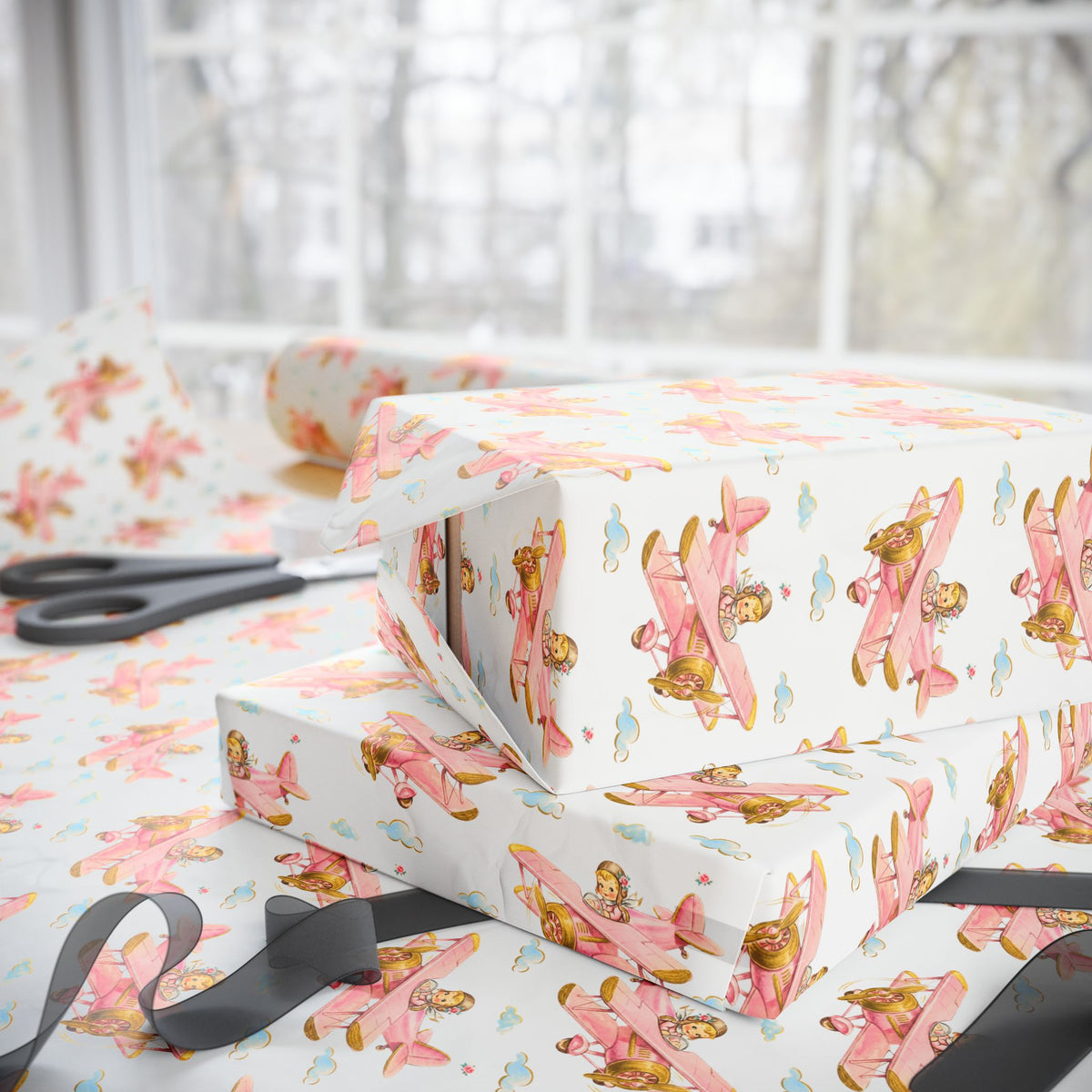 Gift wrap featuring vintage-style girls flying a plane on a light background.