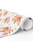 Roll of girl airplane wrapping paper featuring a repeating pastel pink vintage biplane pattern.