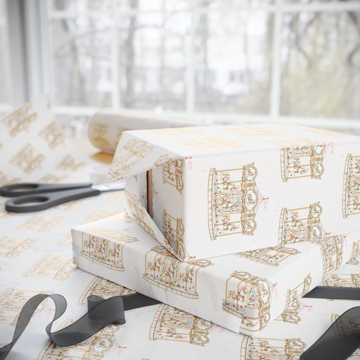 Ivory wrapping paper with a repeating gold carousel illustration pattern, shown wrapped around stacked gift boxes on a table near scissors and ribbon, with a softly blurred window background.