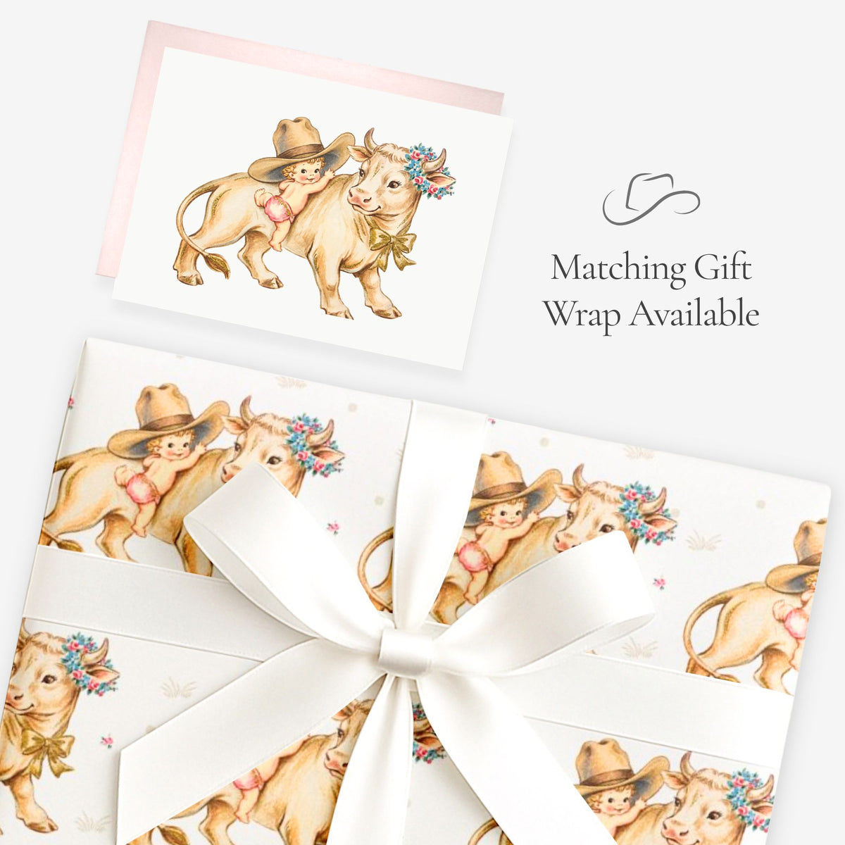 Little cowgirl baby girl greeting card shown with matching vintage-inspired cowgirl gift wrap tied with a white satin bow