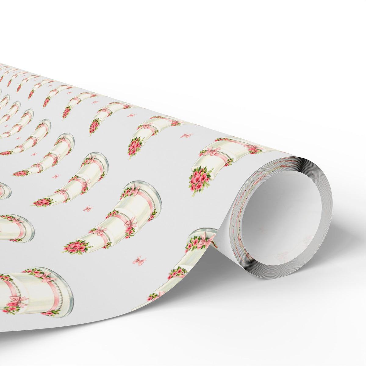 Roll of minimalist wedding cake wrapping paper with white tiered cakes, pink ribbons and rose clusters on a pale gray background