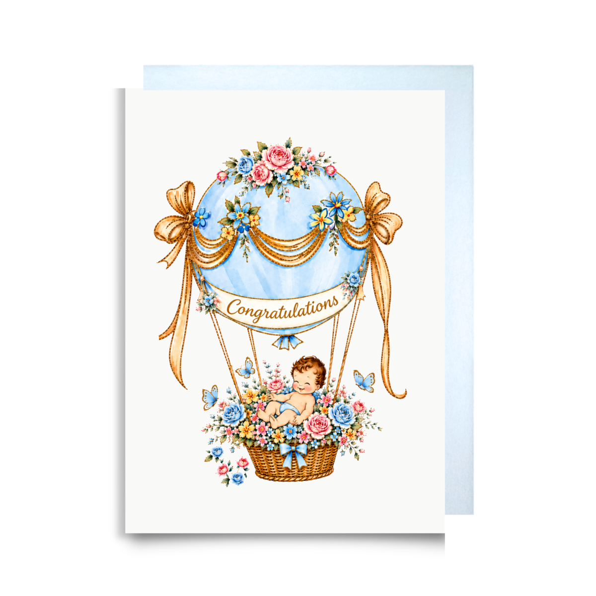 New baby boy card with a baby in a blue floral hot air balloon, golden ribbons and a Congratulations banner