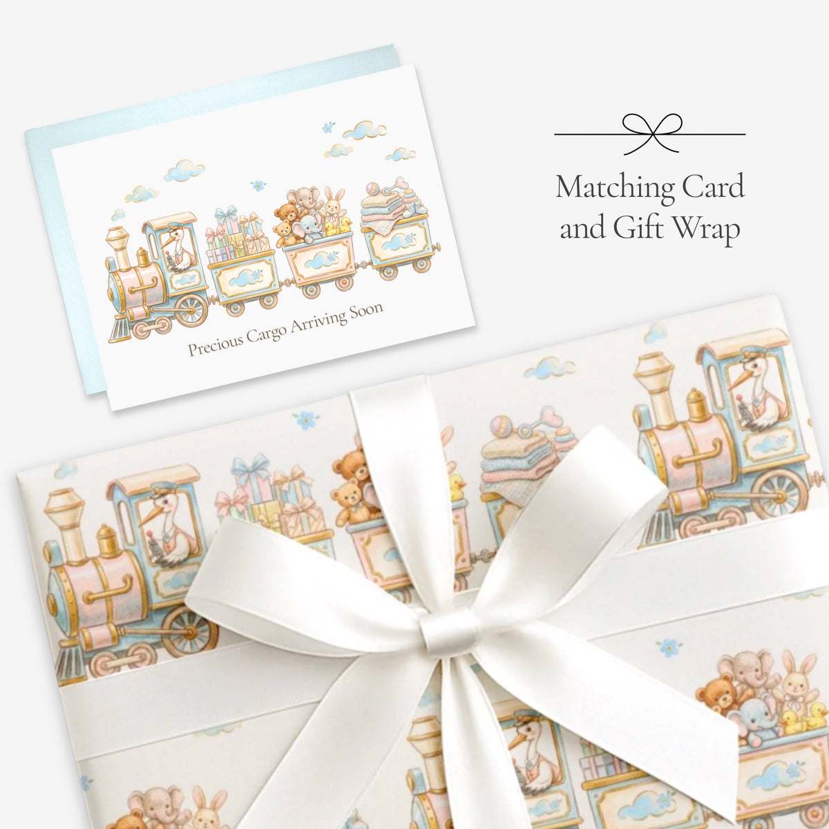 Stork train baby shower card with matching stork train gift wrap tied with a white satin bow, labeled Matching Card and Gift Wrap