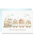 Baby shower card with a stork driving a pastel toy train carrying gifts, teddy bears, bunnies and blankets, reading Precious Cargo Arriving Soon