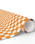 A roll of wrapping paper featuring a checkerboard pattern in orange and soft white, shown on a clean white background.