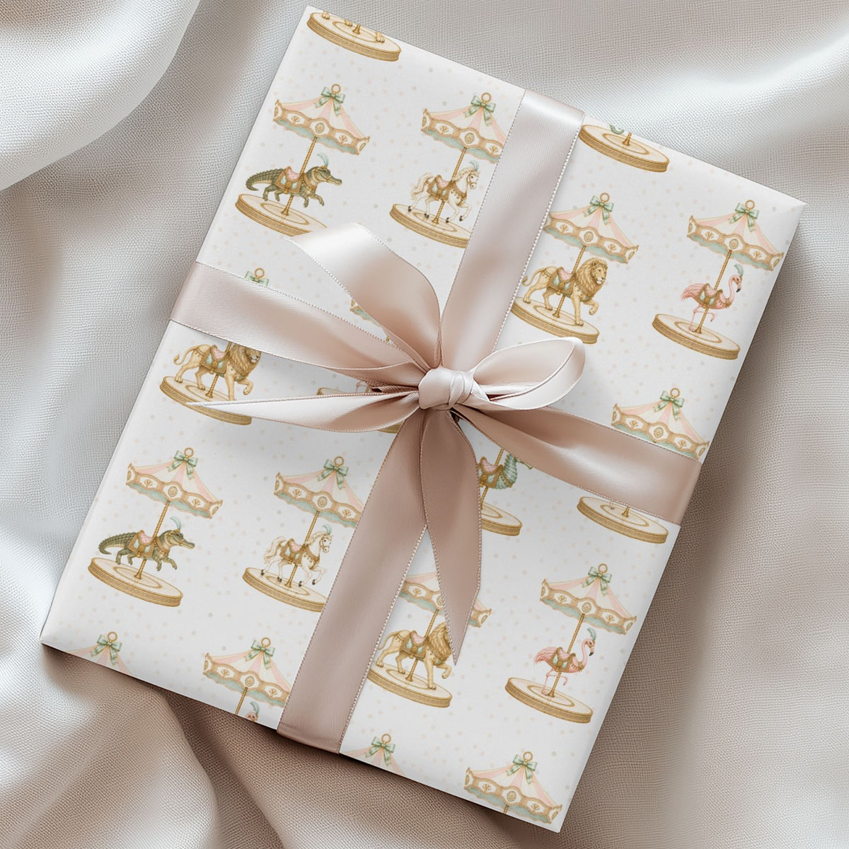 Wrapped gift featuring Palm Beach Carousel Wrapping Paper with carousel animals beneath pastel pink and mint canopies tied with a satin ribbon.