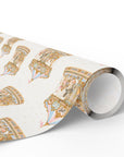Rolled carousel wrapping paper in blush and blue with vintage style merry go round animals.
