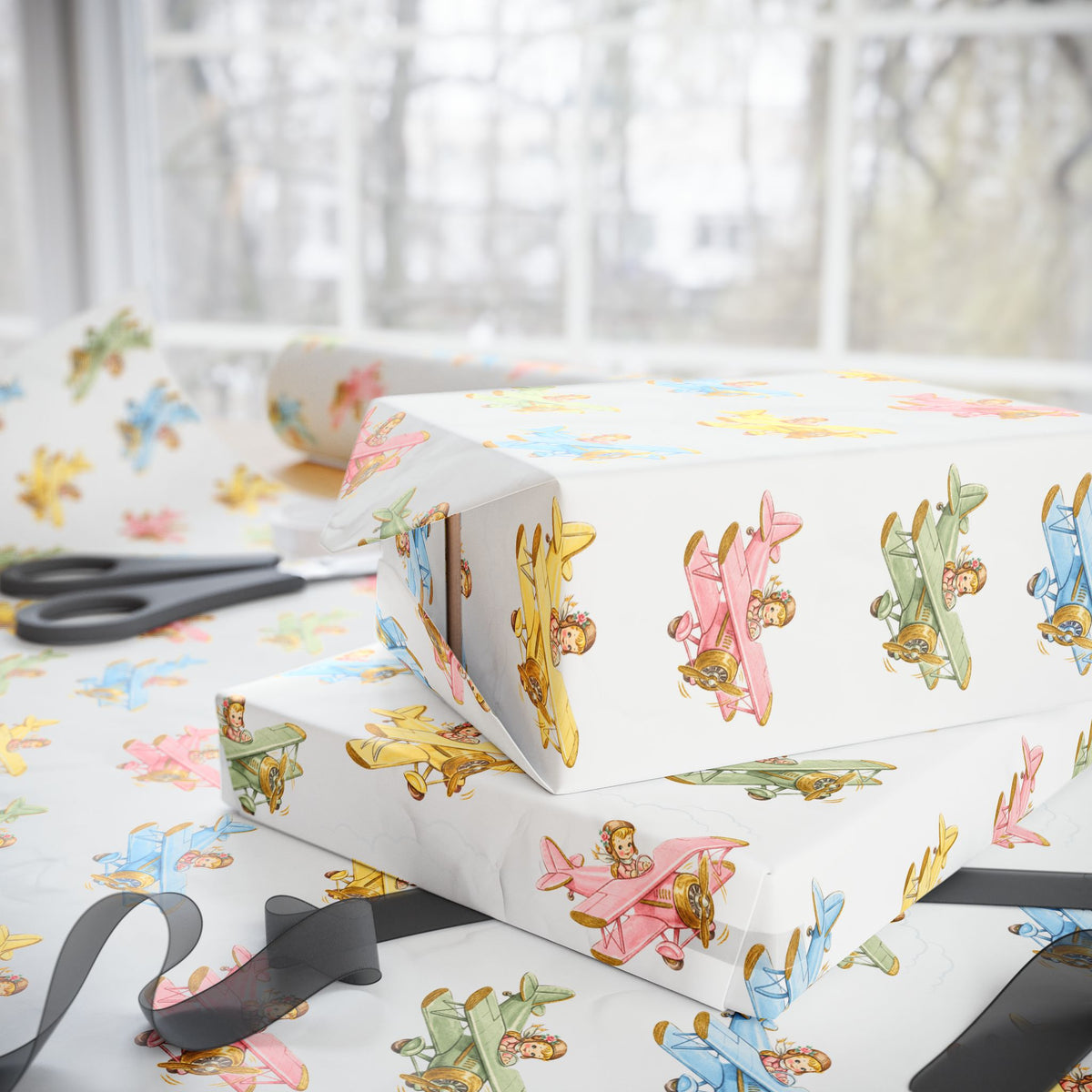 Gift box wrapped in colorful airplane-themed nursery-paper.