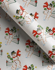 Vintage-style pickleball Christmas wrapping paper with retro snowmen in top hats and red scarves playing pickleball on a snowy court.