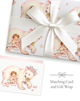 Polar bear baby girl wrapping paper with matching winter baby shower card and white ribbon
