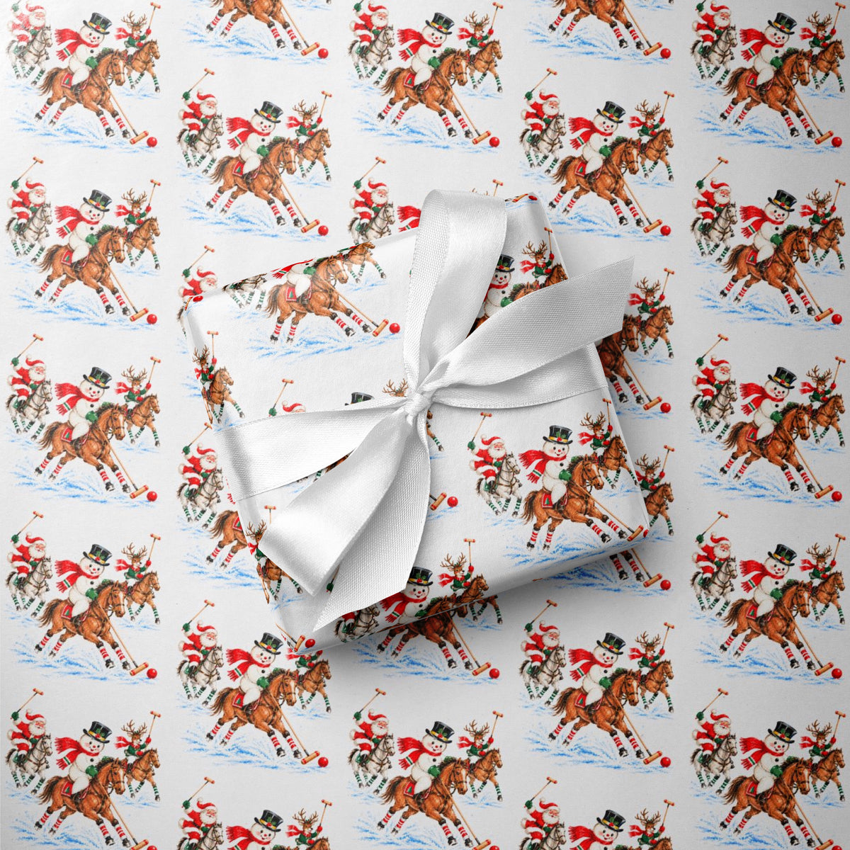 Gift wrapped in vintage-style polo match Christmas wrapping paper with Santa, a snowman and a reindeer on ponies, tied with a white satin bow