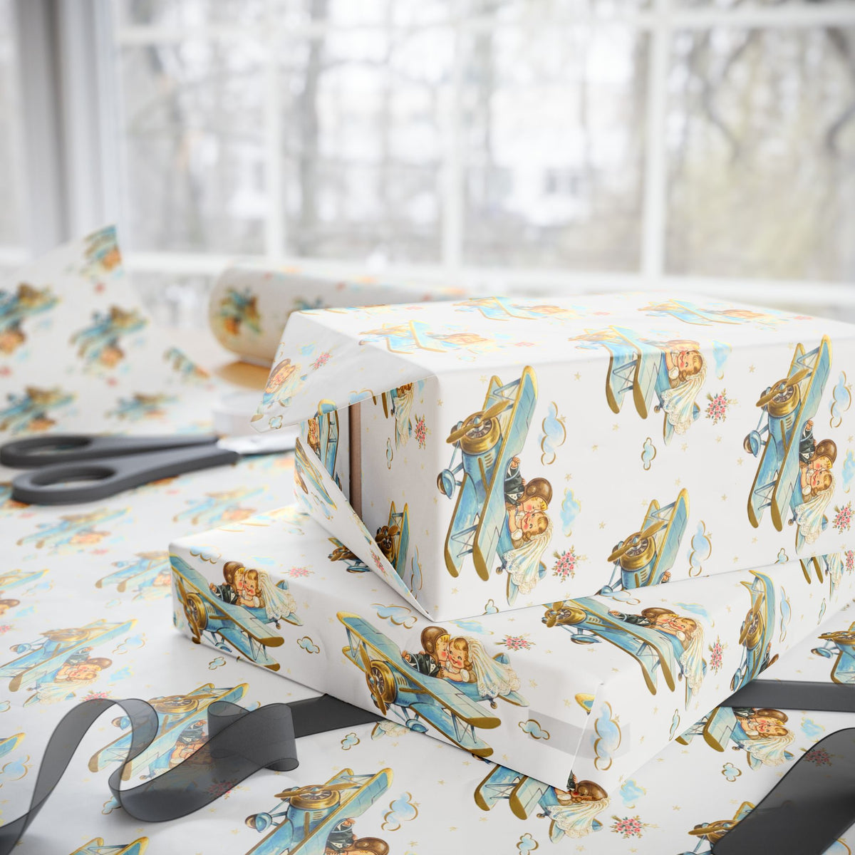 Gift-wrapping paper with a storybook illustration of a bride and groom kissing midair in their biplane.
