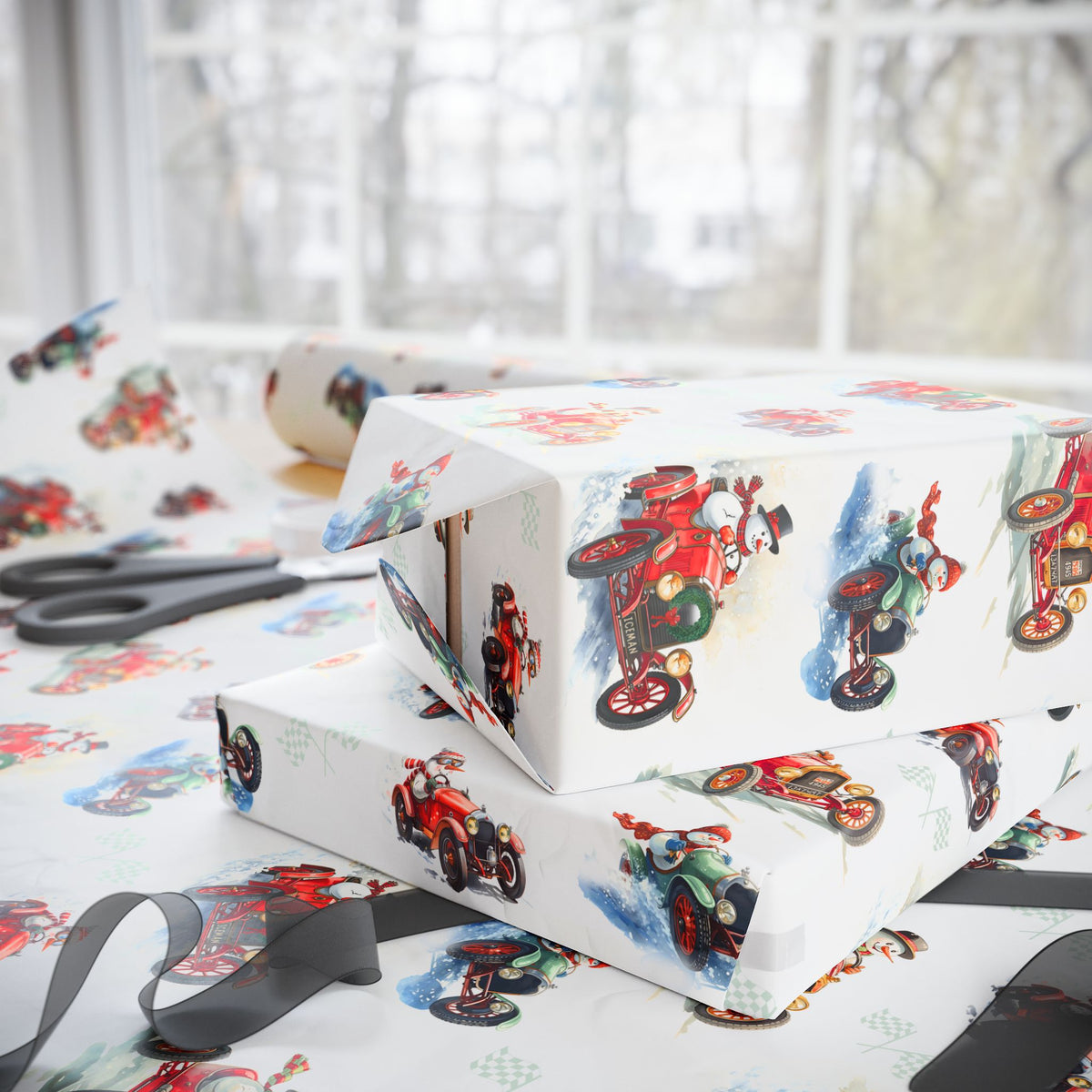Stacked Christmas gifts wrapped in vintage-style snowman race car wrapping paper on a wrapping table with scissors and black ribbon