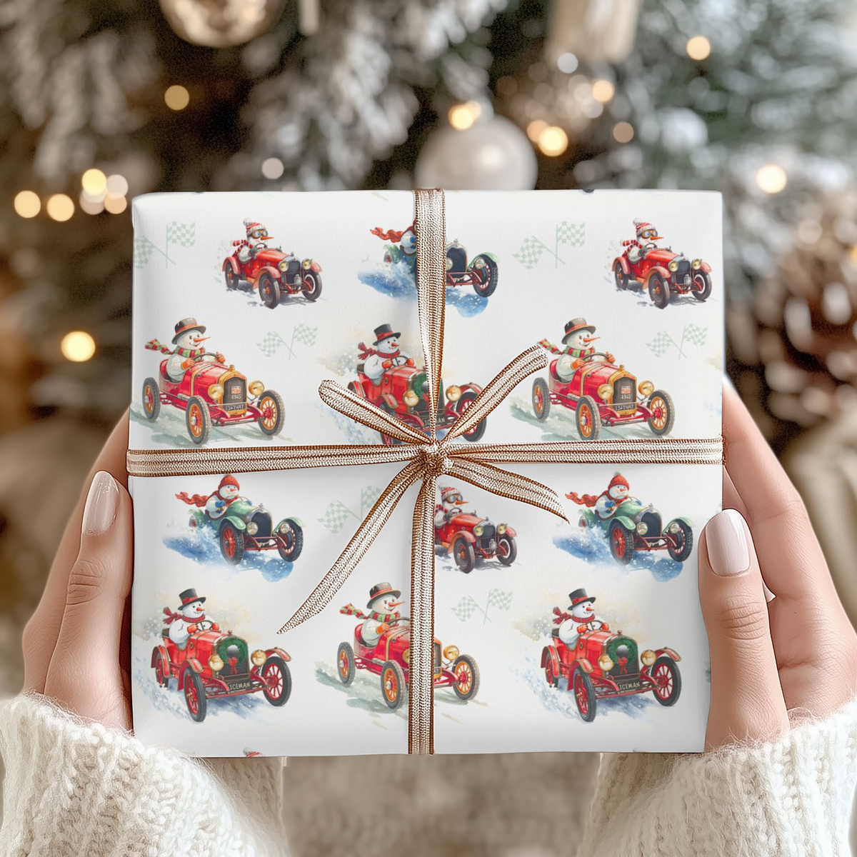 Hands holding a Christmas gift wrapped in vintage-style snowman race car wrapping paper with a copper striped ribbon bow