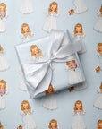 Gift wrapped in pastel blue retro bride-to-be wrapping paper tied with a white satin ribbon, featuring 1950s style illustrated blonde brides, pink bouquet, and a cute kitten.
