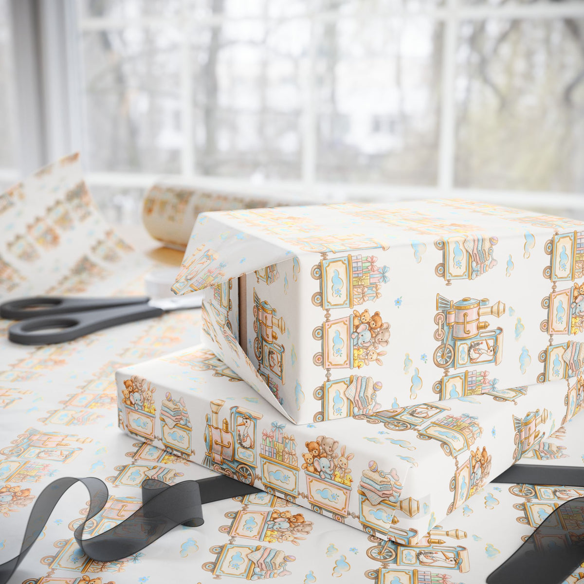 A stack of gift boxes wrapped in ivory wrapping paper with a vintage illustrated pattern of storks and trains, set on a table with scissors and ribbon.