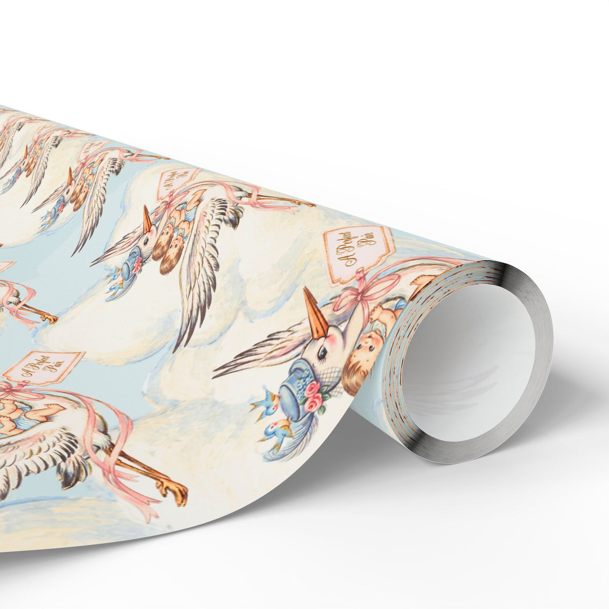 Roll of twin boys stork wrapping paper showing storks in blue clouds with pink ribbons