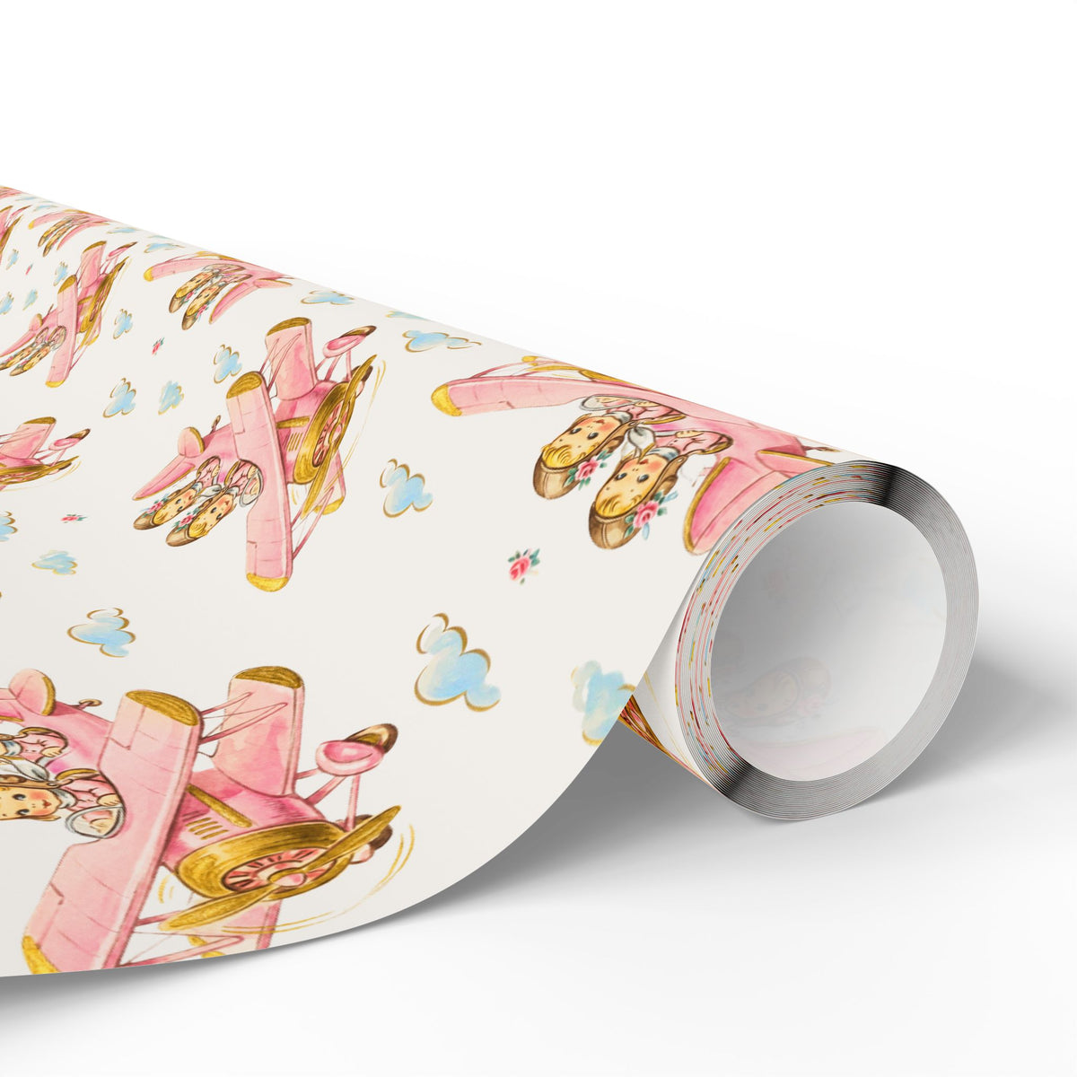 Roll of twin baby girl airplane wrapping paper featuring a repeating pastel pink vintage biplane pattern.