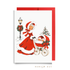 Vintage-style twins first Christmas card: a woman in a red coat trimmed with white fur pushes a pram with two sleepy babies past a wreath-trimmed lamppost, shown with a red envelope, Double the Joy twin baby shower card