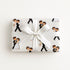 Vintage-style first dance wrapping paper with a bride and groom dancing in a tuxedo, white gown and veil, shown on a wrapped gift