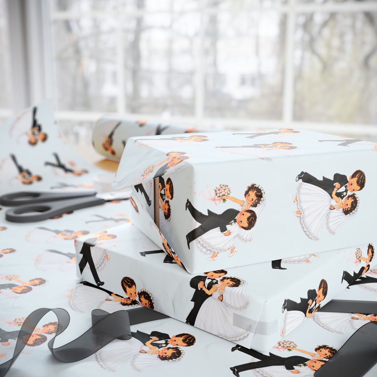 Stacked wedding gifts wrapped in vintage-style first dance bride and groom wrapping paper on a wrapping table with scissors and sheer ribbon