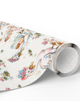 Roll of baby wrapping paper featuring colorful swans and babies on a light background.