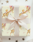 Wild one first birthday gift wrapped in safari giraffe wrapping paper with a cream ribbon bow and scattered stars