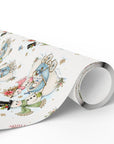 Roll of vintage-style snowman baby boy Christmas wrapping paper with snowmen and blue baby carriages, blue snowman gift wrap roll